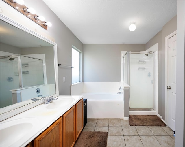 bathroom with vanity, tile patterned flooring, and shower with separate bathtub