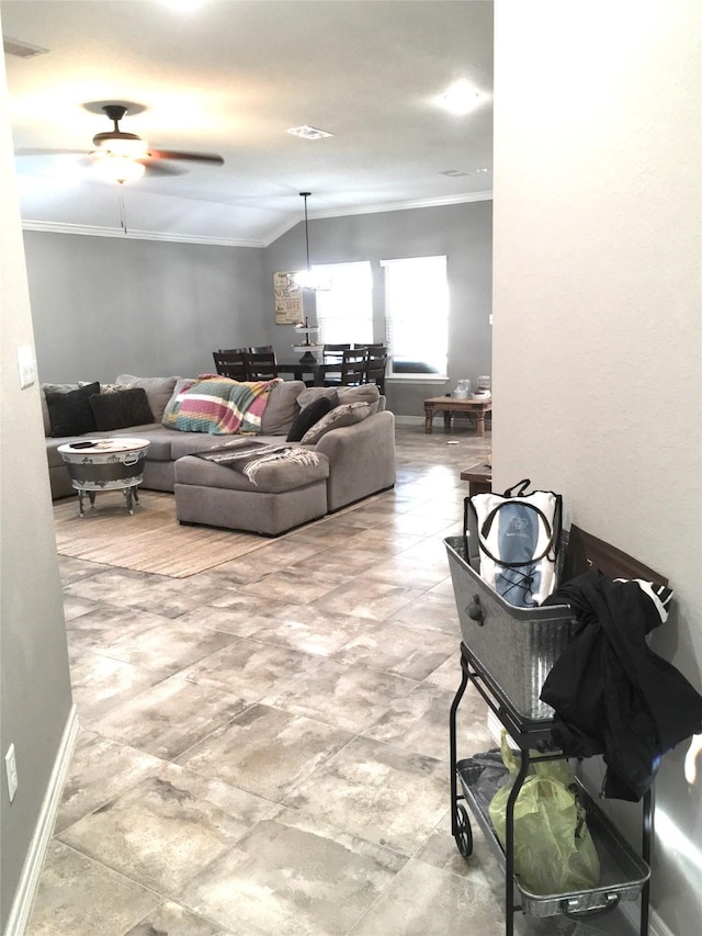 living room with ceiling fan and ornamental molding