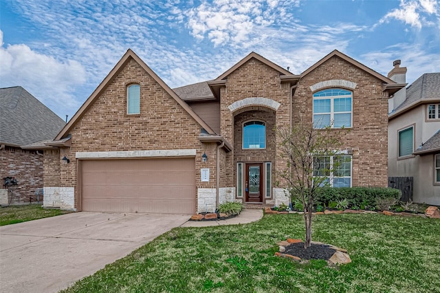 front of property featuring a front lawn and a garage