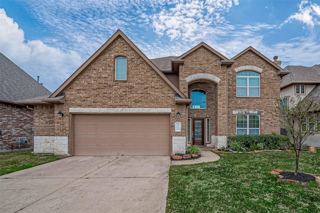 front of property featuring a front yard and a garage