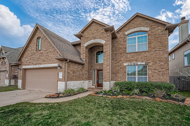 front facade featuring a front yard and a garage