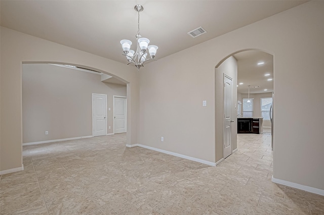 empty room with a chandelier