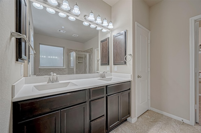 bathroom with an enclosed shower and vanity