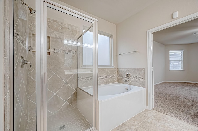 bathroom featuring separate shower and tub and tile patterned floors