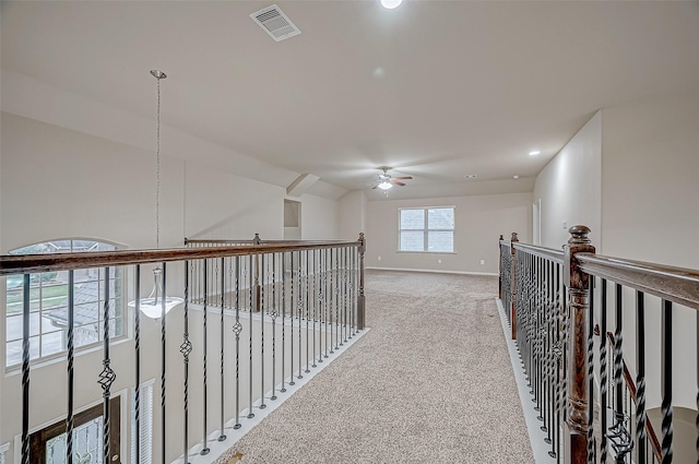 hallway with carpet floors