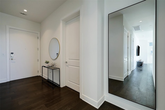 hall featuring dark wood-type flooring