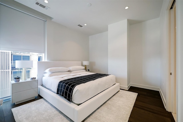 bedroom featuring dark hardwood / wood-style flooring