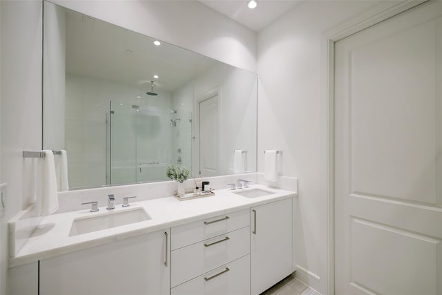 bathroom with an enclosed shower and vanity