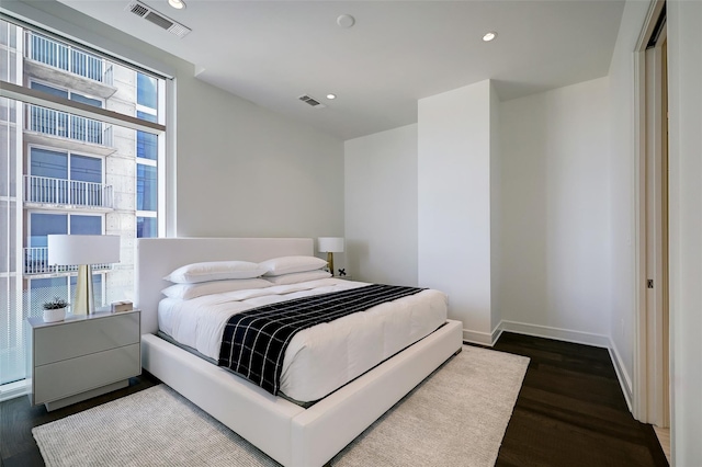 bedroom featuring dark wood-type flooring