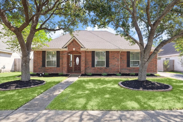 ranch-style house featuring a front lawn