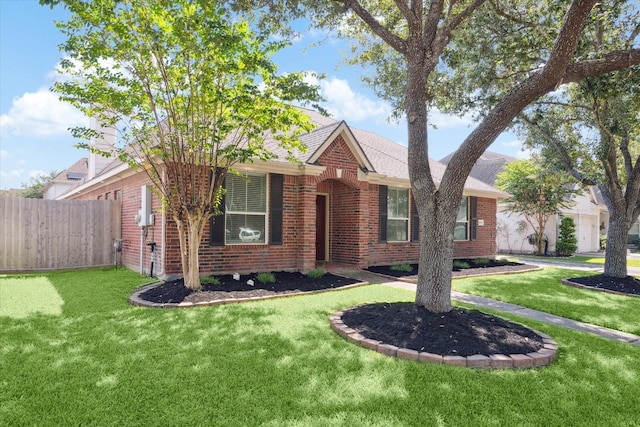 ranch-style home featuring a front yard