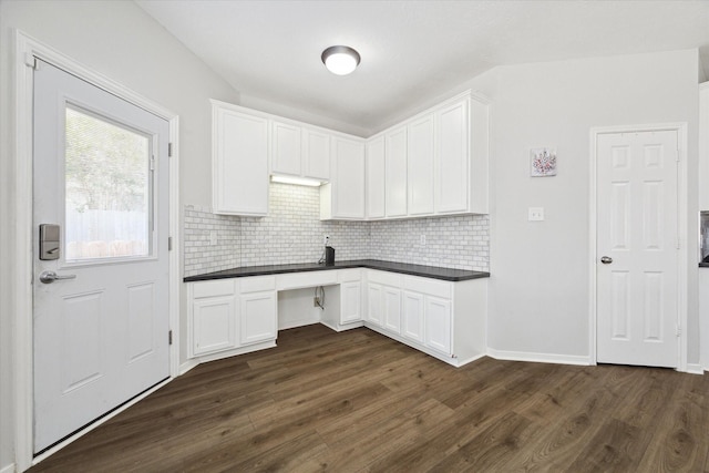 kitchen with white cabinets, dark hardwood / wood-style flooring, and decorative backsplash