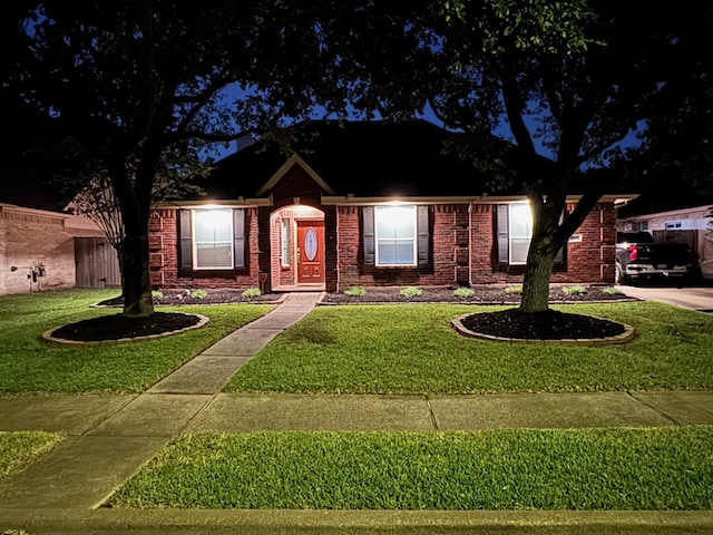 view of front of home with a lawn