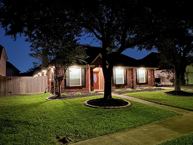 view of front of house with a lawn