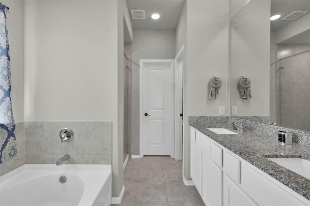 bathroom with separate shower and tub, vanity, and tile patterned floors