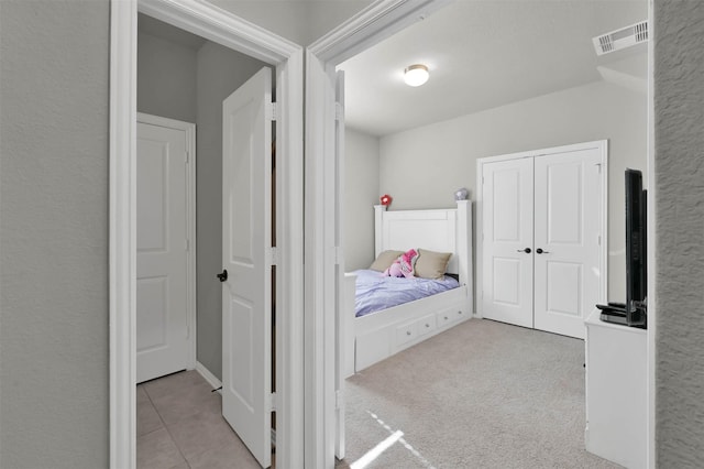 bedroom with light colored carpet