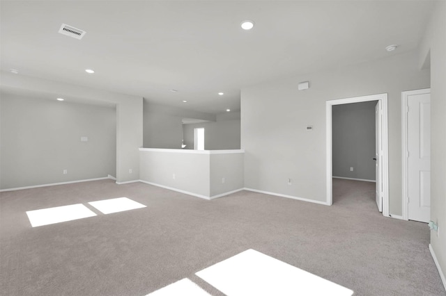 empty room featuring light colored carpet