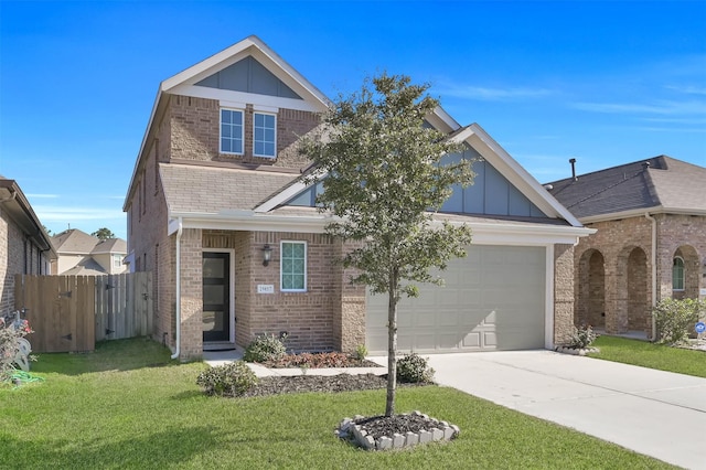 view of front of home featuring a front lawn and a garage