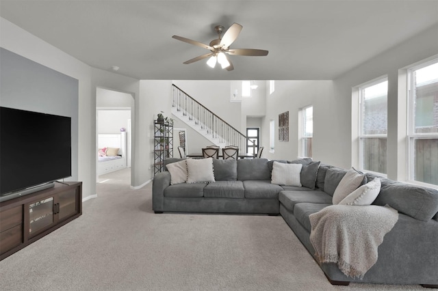 living room with light carpet and ceiling fan