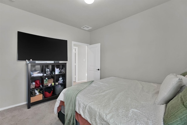 bedroom featuring light colored carpet