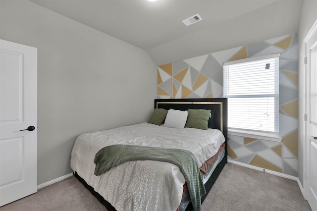 carpeted bedroom featuring lofted ceiling