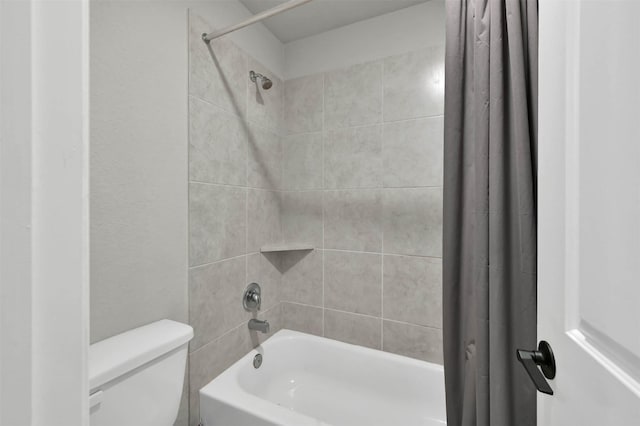 bathroom featuring toilet and shower / tub combo