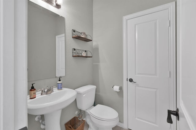 bathroom featuring toilet