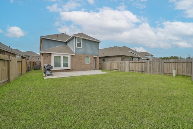 rear view of house featuring central AC unit, a lawn, and a patio