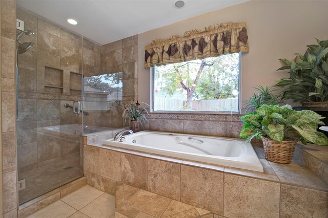 bathroom featuring plus walk in shower and tile patterned floors