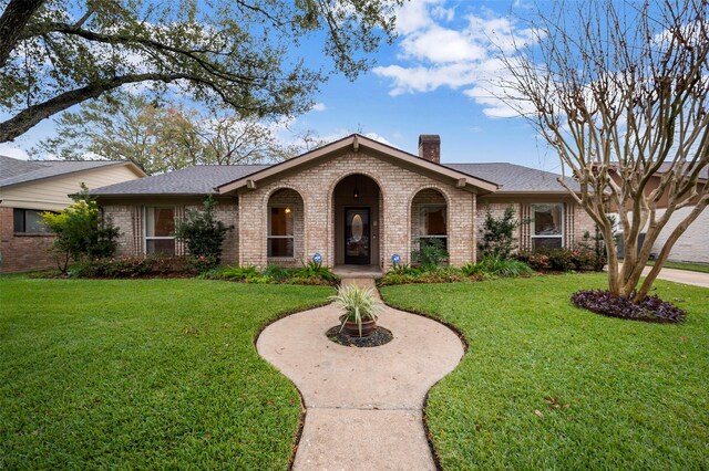 ranch-style house with a front lawn