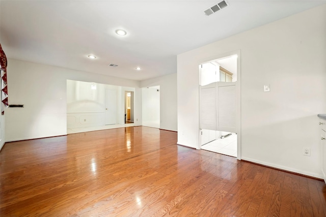 spare room featuring light hardwood / wood-style flooring