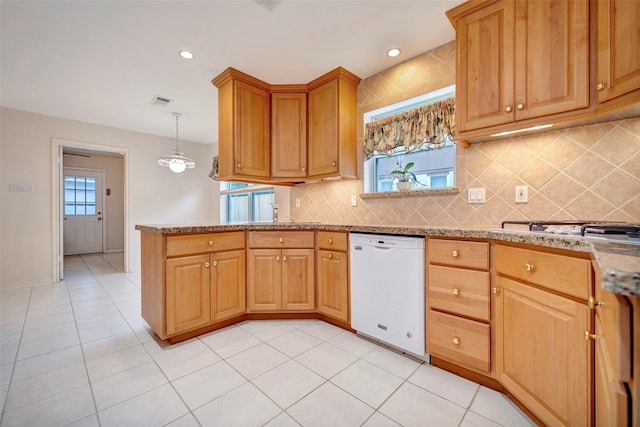 kitchen with light tile patterned floors, gas cooktop, hanging light fixtures, white dishwasher, and tasteful backsplash