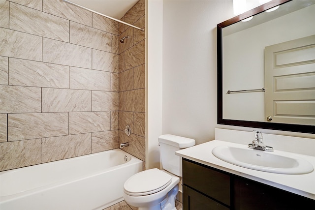 full bathroom featuring toilet, vanity, and tiled shower / bath