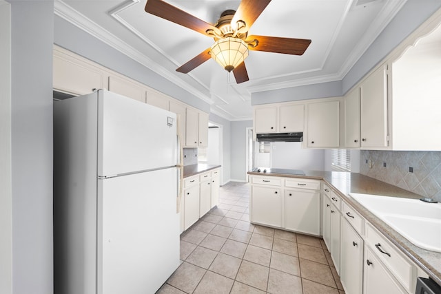 kitchen with light tile patterned floors, ceiling fan, white cabinetry, kitchen peninsula, and white fridge