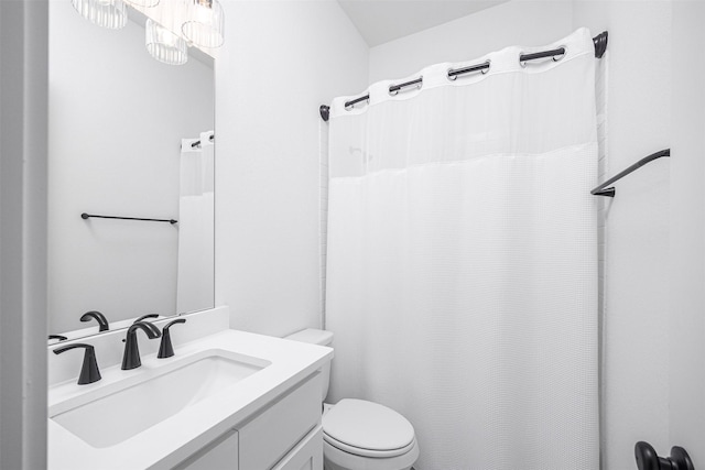 bathroom featuring toilet and vanity