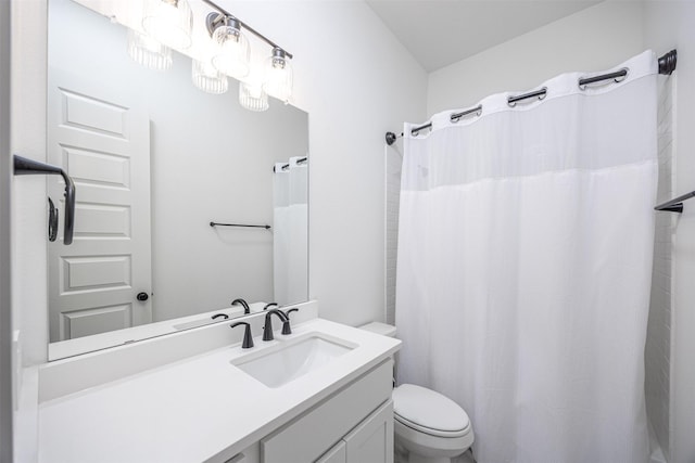 bathroom with a shower with curtain, vanity, and toilet