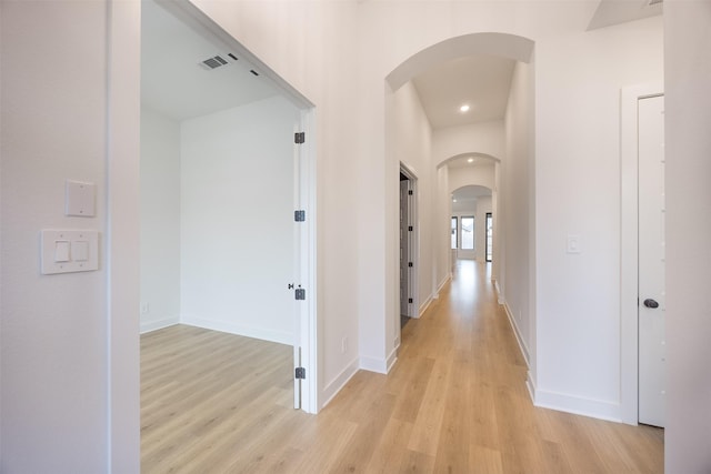 corridor featuring light hardwood / wood-style flooring