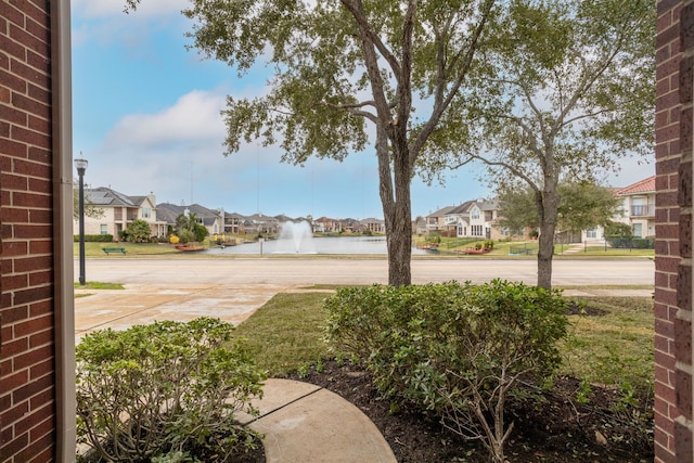 view of yard with a water view