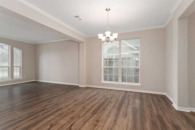 spare room with ornamental molding, dark hardwood / wood-style flooring, and an inviting chandelier