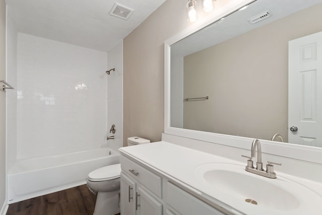 full bathroom with toilet, shower / bath combination, vanity, and hardwood / wood-style floors