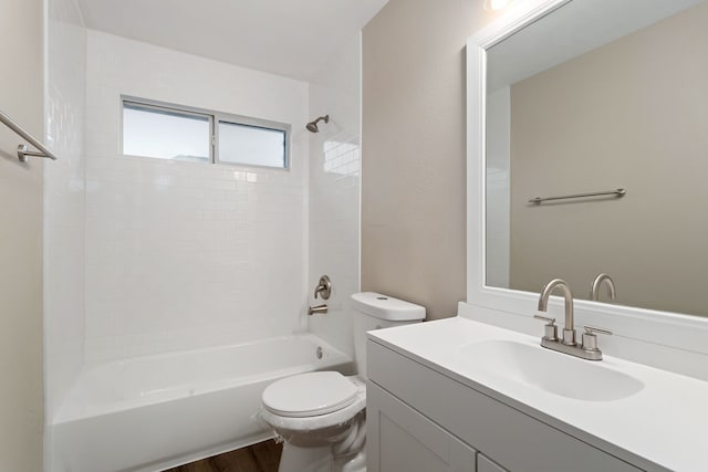 full bathroom featuring toilet, hardwood / wood-style flooring, shower / washtub combination, and vanity