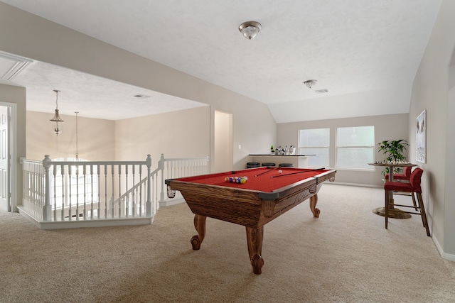 rec room featuring a textured ceiling, pool table, light carpet, and vaulted ceiling