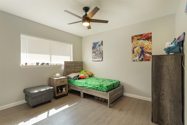 bedroom featuring ceiling fan and light hardwood / wood-style flooring