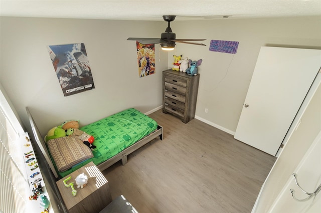 bedroom featuring ceiling fan and hardwood / wood-style floors