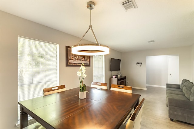 dining space featuring light wood-type flooring