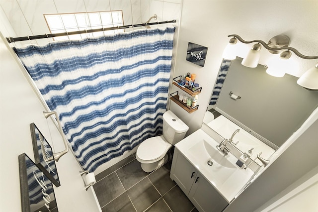 bathroom with toilet, a shower with shower curtain, vanity, and tile patterned flooring