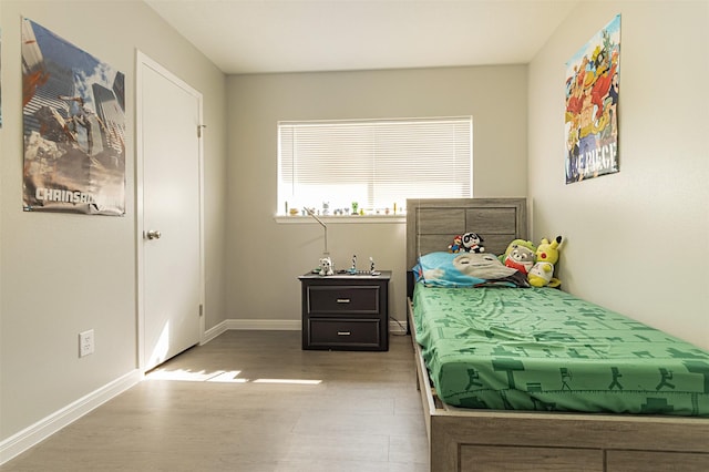 bedroom with light hardwood / wood-style flooring