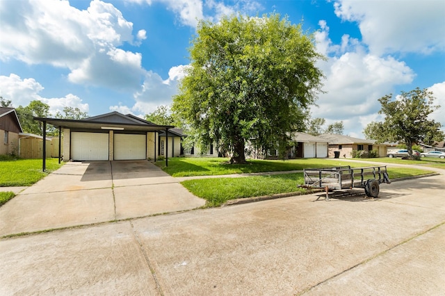 view of front of property with a garage and a front yard