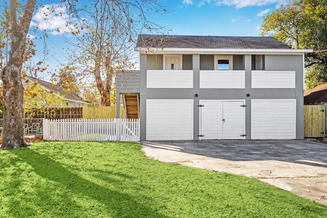 garage featuring a yard