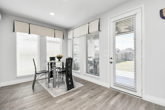 dining area with hardwood / wood-style floors